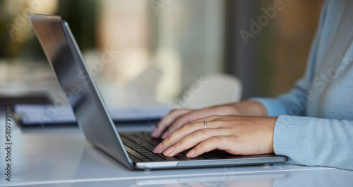 Business, laptop and hands typing in office for email, report or project in workplace. Computer, keyboard and professional woman or female writing research, planning or internet browsing in company.