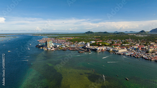 Aerial drone of Semporna, on the southeastern coast of the state of Sabah in Malaysia, is a county in the Tawau District. photo