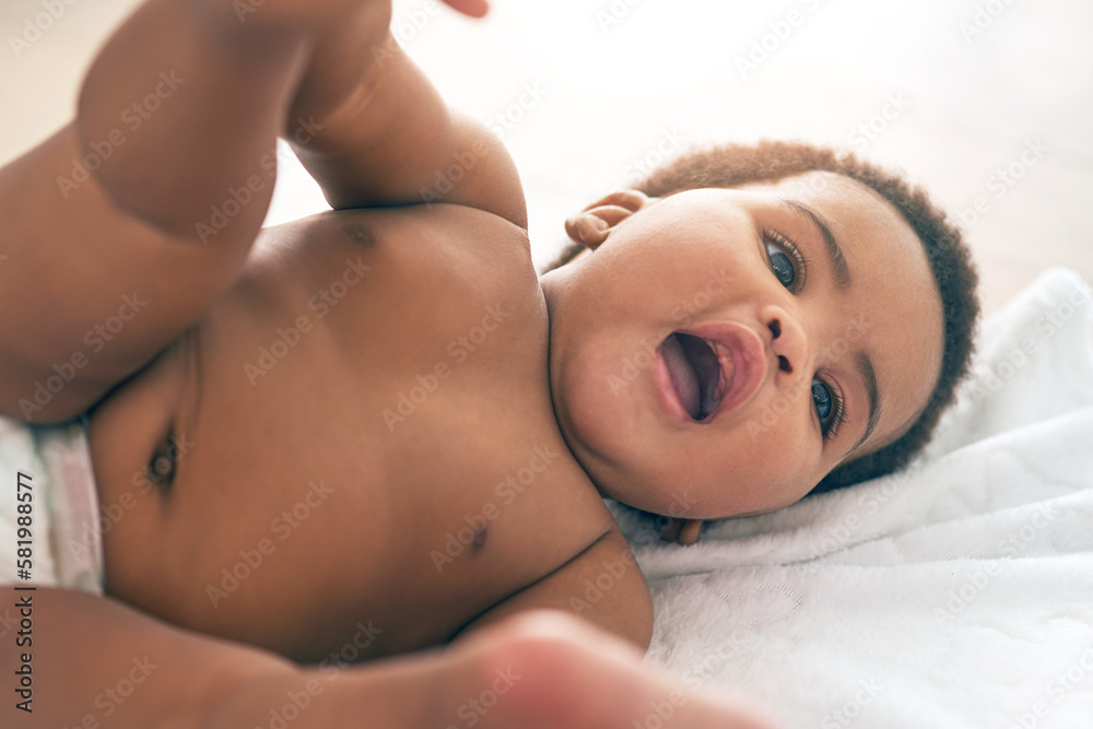 Kids, black baby and a girl lying on a towel in her home for growth or child development from above. Children, bedroom and cute with a newborn infant female resting on a bed to relax in a house Kids, black baby and a girl lying on a towel in her home for growth or child development from above. Children, bedroom and cute with a newborn infant female resting on a bed to relax in a house