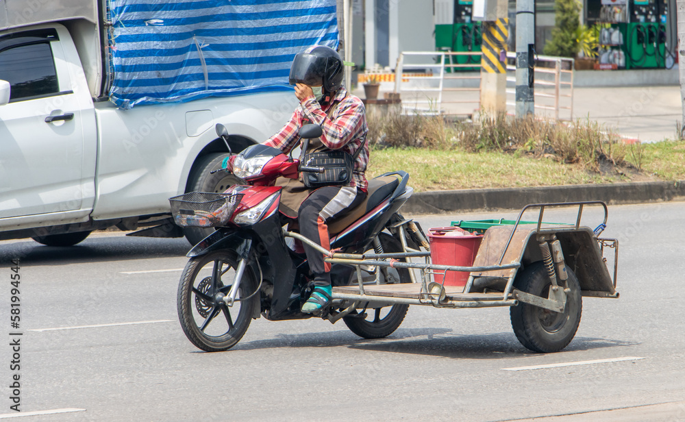 A man drives a motorcycle with an sidecar