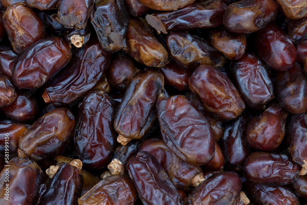 Dates (date palm fruits) displayed on the food market. Close up of dates on market stand. Dates (date palm fruits) displayed on the food market. Close up of dates on market stand.