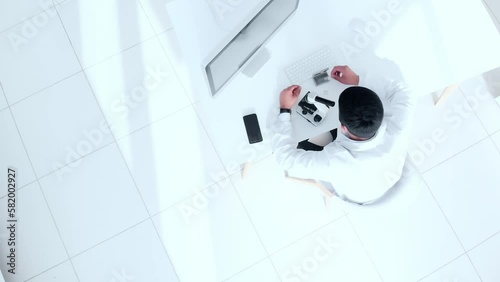 scientist examining liquid samples in the laboratory. top view.
