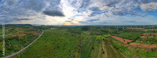 Wide shot of rural area with sunset powered by green energy that is friendly to nature.