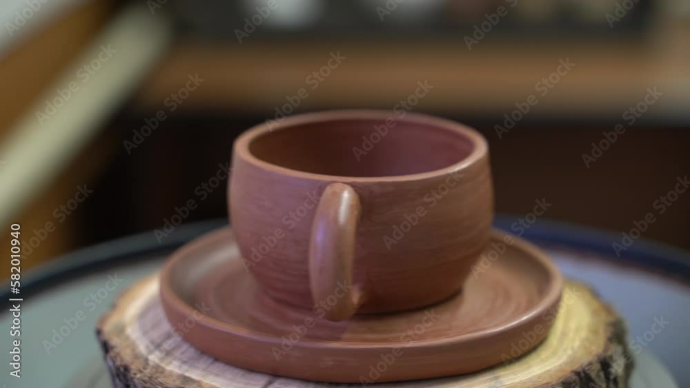 Ceramics, a ceramic product made with their own hands on a potter's wheel, a mug. Ceramics, a ceramic product made with their own hands on a potter's wheel, a mug.