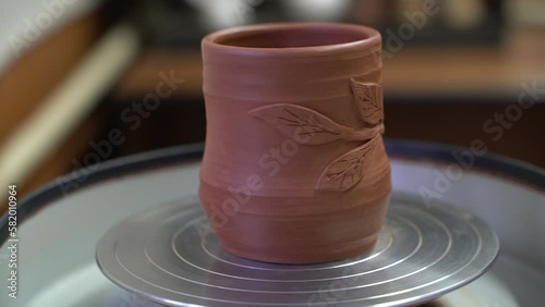 Ceramics, a ceramic product made with their own hands on a potter's wheel, a mug.