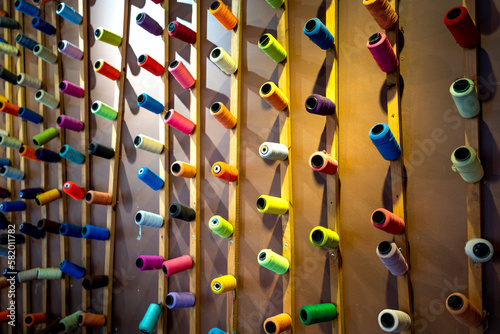 A corner of the cafe is decorated with colorful spools of thread on the wall in Pleiku Town  Vietnam 