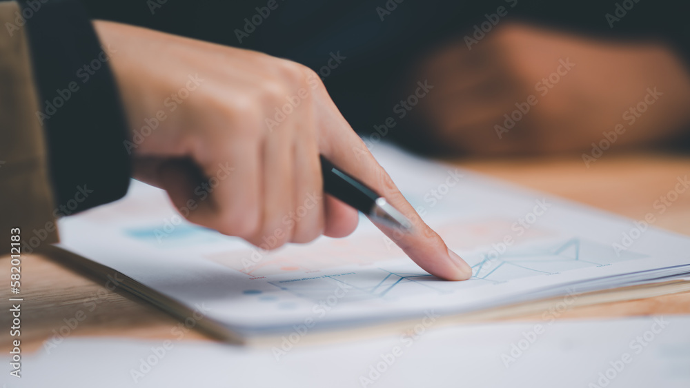 Business people read business statistics chart reports, to analyze and improve corporate strategy, manage financial and marketing documents, update annual budget accounts, company growth data Business people read business statistics chart reports, to analyze and improve corporate strategy, manage financial and marketing documents, update annual budget accounts, company growth data