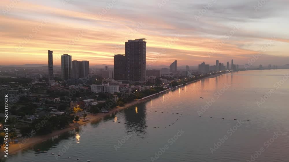 Aerial view of Pattaya sea, beach in Thailand in summer season, urban city with blue sky for travel background. Chon buri skyline.