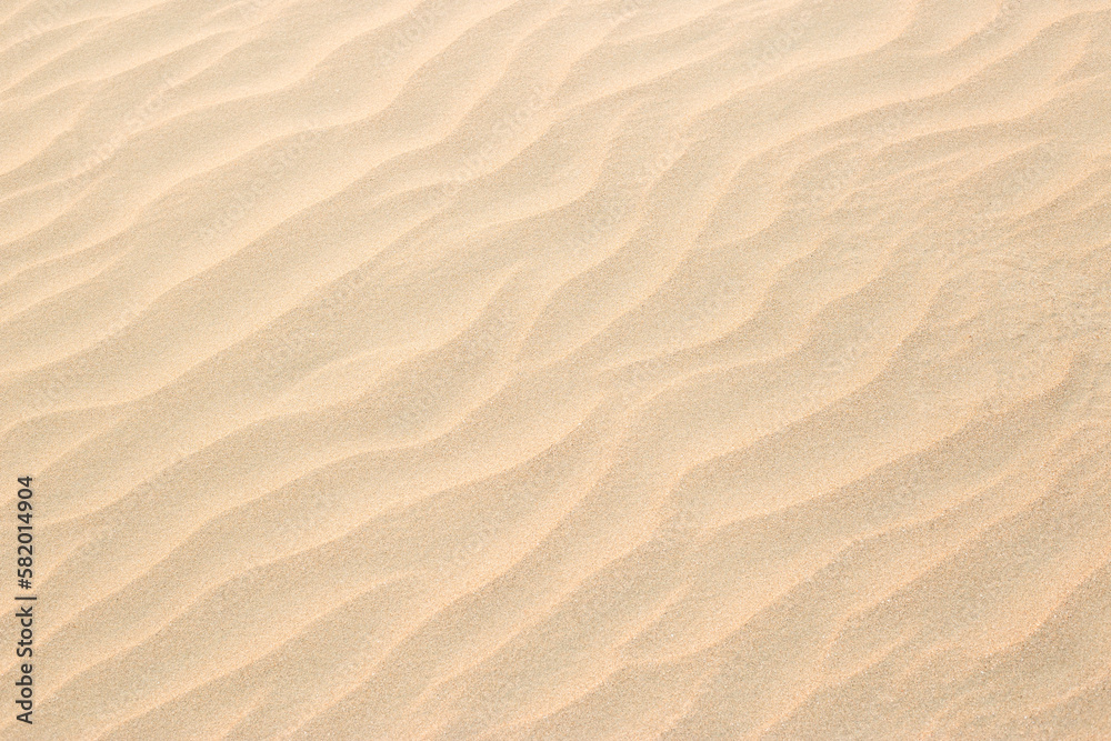 Abstract background of sandy sea on the beach. Wave sand texture Abstract background of sandy sea on the beach. Wave sand texture