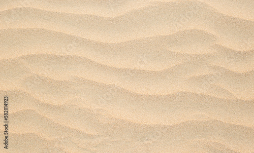 Abstract background of sandy sea on the beach. Wave sand texture