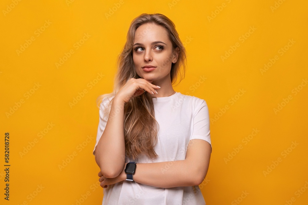 horizontal photo of a blond girl with empty space on a yellow background horizontal photo of a blond girl with empty space on a yellow background