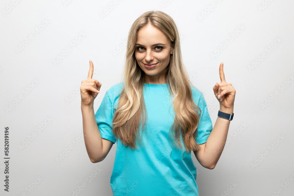young woman showing thumbs up on white background young woman showing thumbs up on white background