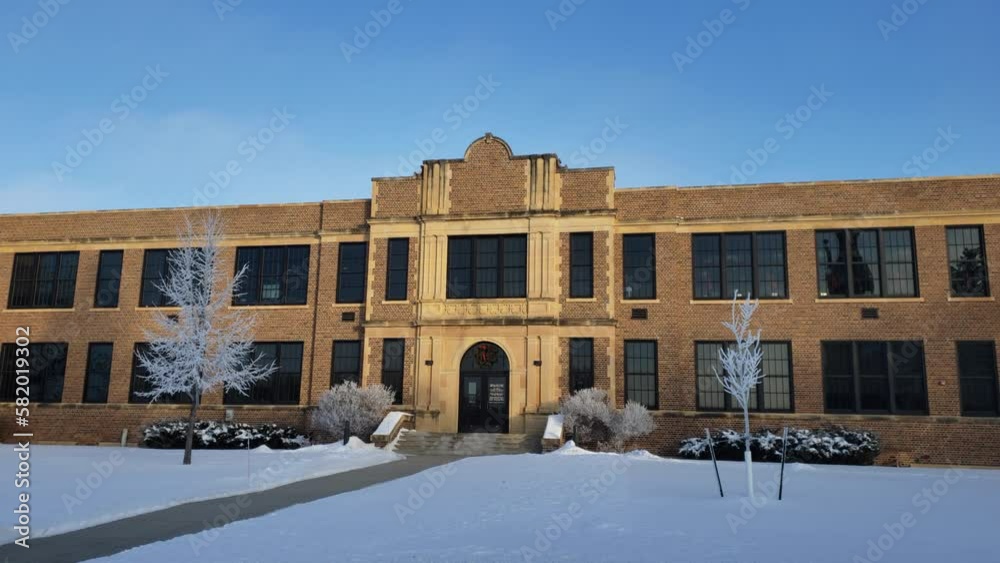 Front of school exterior day. snow winter Front of school exterior day. snow winter