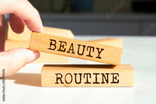 Wooden blocks with words 'Beauty routine'.