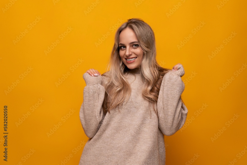 joyful young woman over isolated studio yellow background joyful young woman over isolated studio yellow background