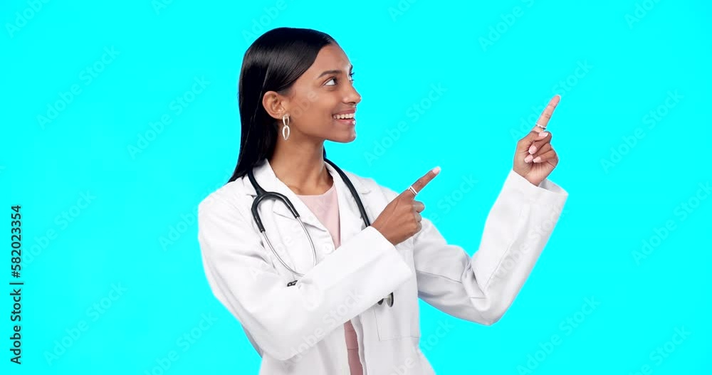 Medical doctor, studio and happy woman point at healthcare promotion, hospital notification or clinic announcement mockup. Nurse portrait, advertising surgeon and marketing person on blue background Medical doctor, studio and happy woman point at healthcare promotion, hospital notification or clinic announcement mockup. Nurse portrait, advertising surgeon and marketing person on blue background