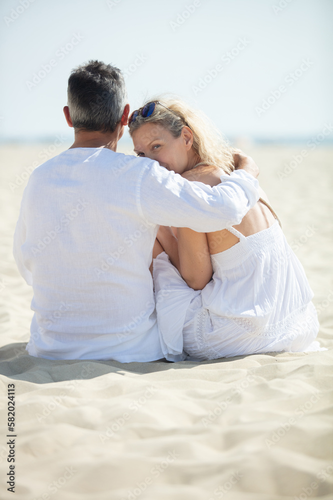portrait of happy mature couple at the beach portrait of happy mature couple at the beach