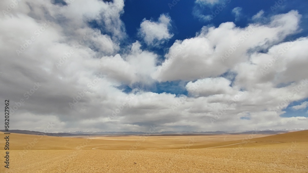 Blue sky and clouds over a desert Blue sky and clouds over a desert