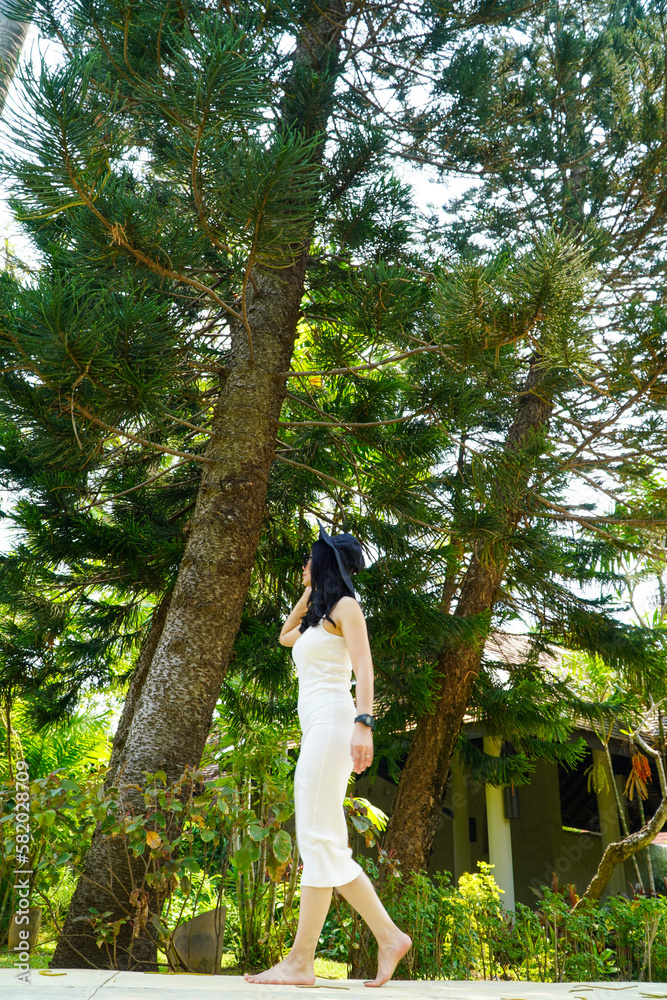 woman in black hat walking in foresthat, woman in black hat walking in foresthat,