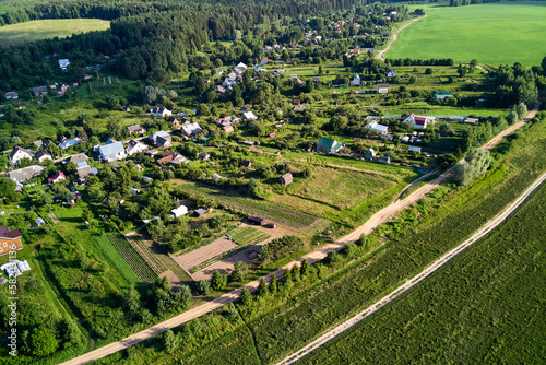 Aerial view of village plots with vegetable gardens and houses. Podchervino village, Zhukovsky district, Kaluzhskiy region, Russia photo