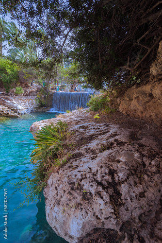 A turquoise freshwater lake inside the Gan HaSlosha Nature Reserve - Sakhana, in the Beit Shean Valley - Israel
