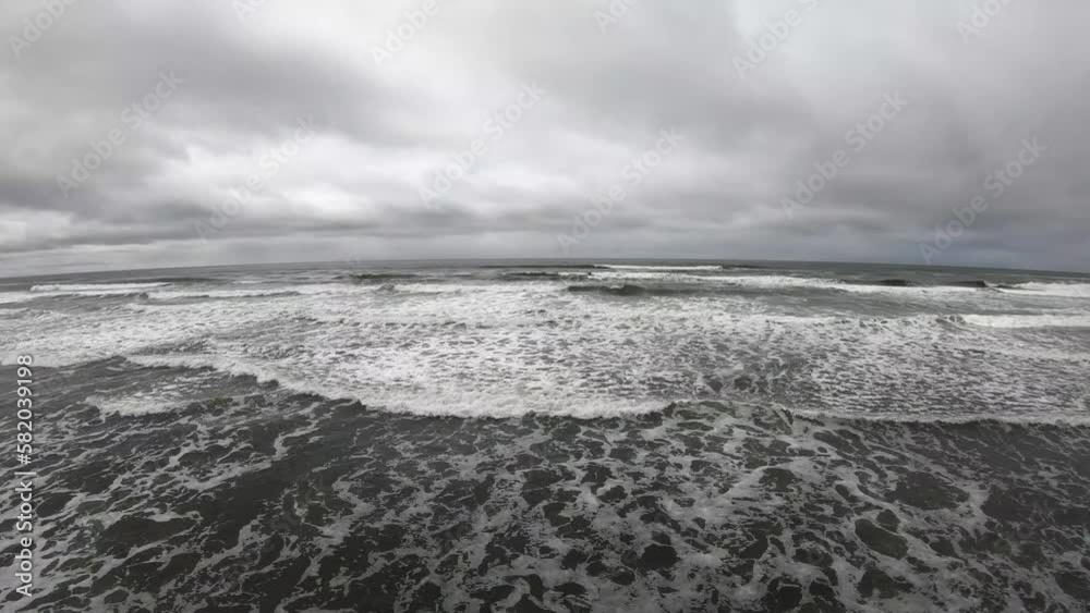 Drone flight, flying over the coast of the northwestern United States. A cloudy and gray day The waves are foamy. Drone flight, flying over the coast of the northwestern United States. A cloudy and gray day The waves are foamy.