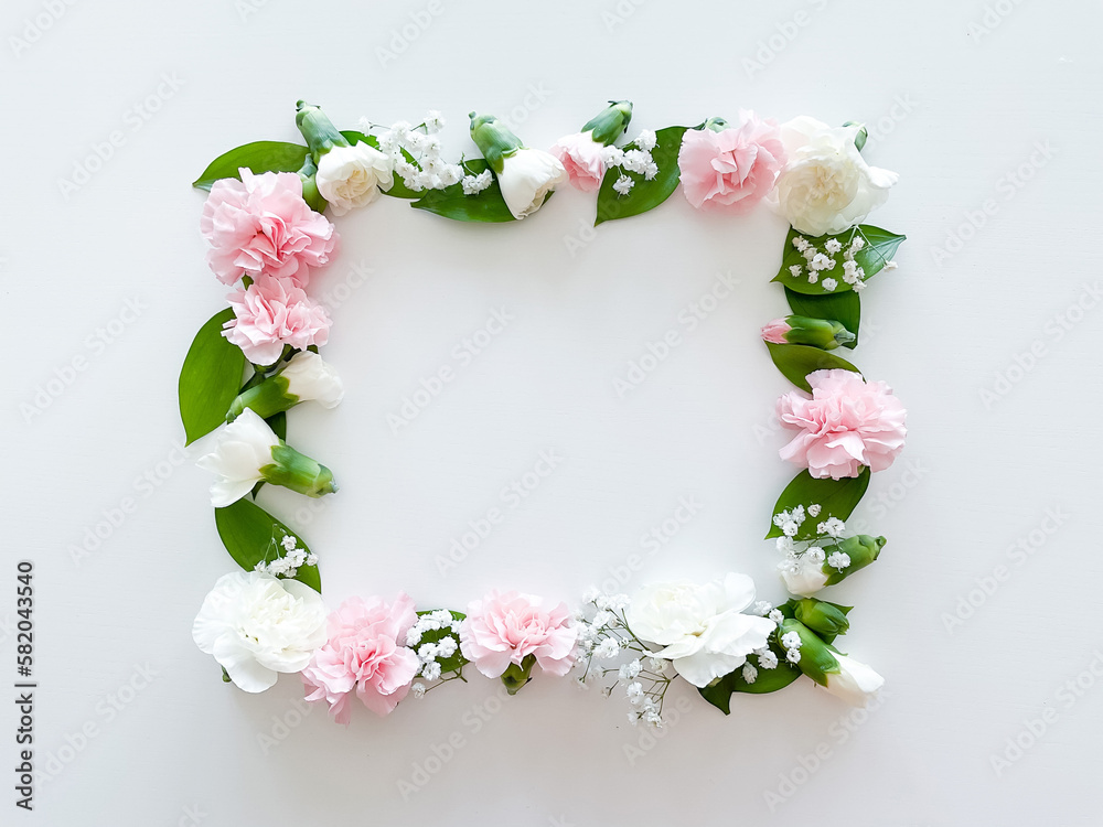 Square frame of pink and white carnations, leaves Square frame of pink and white carnations, leaves