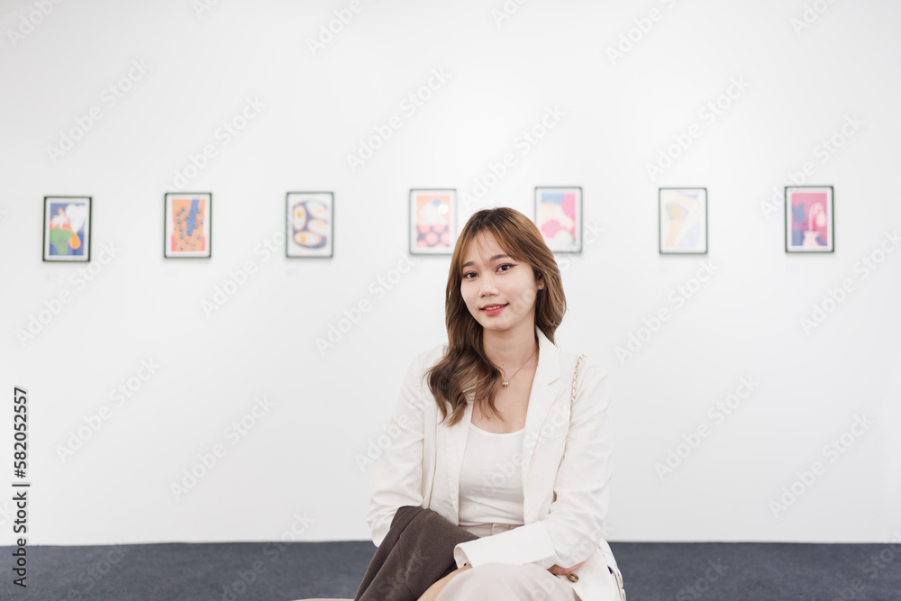 Woman visiting art gallery her looking pictures on wall watching photo frame painting at artwork museum people lifestyle concept. Woman visiting art gallery her looking pictures on wall watching photo frame painting at artwork museum people lifestyle concept.