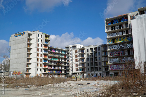 Unfinished, abandoned residential building covered with graffiti