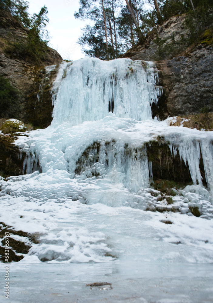 Background Icicles of ice in the winter of a frozen waterfall in a winter wonderland. Catalan Pyrenees Spain. Vertical photography Background Icicles of ice in the winter of a frozen waterfall in a winter wonderland. Catalan Pyrenees Spain. Vertical photography