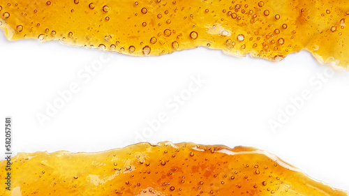 cannabis golden shatter resin extract and white background with copy space  place for text photo