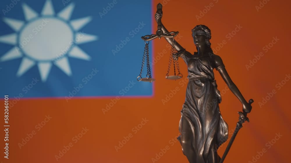 The Statue of Justice - lady justice, Justitia the Roman goddess of Justice. Woman of law. Taiwanese flag and justice system The Statue of Justice - lady justice, Justitia the Roman goddess of Justice. Woman of law. Taiwanese flag and justice system