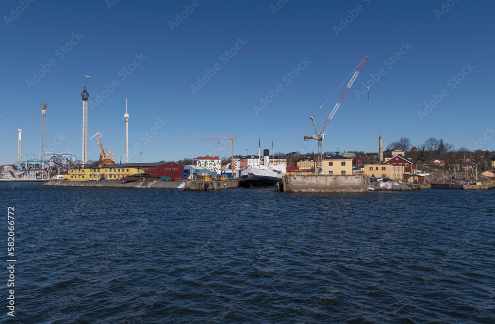 The wharf island Beckholmen, old ice breaker ship in a dry dock, Tivoli tower in back ground, a sunny spring day in Stockholm