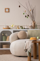 Spring composition of easter living room interior with mock up poster frame,  modern sideboard, coffee table easter cake, eggs, round pillow, easter bunny and personal accessories. Home decor Template