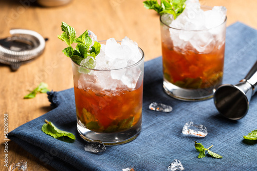 Mint Julep cocktail booze refreshing bourbon whiskey, syrup and mint leaves photo