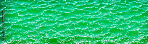 Green water surface background with transparent ripples and minty texture, representing skincare and beauty products. Vector