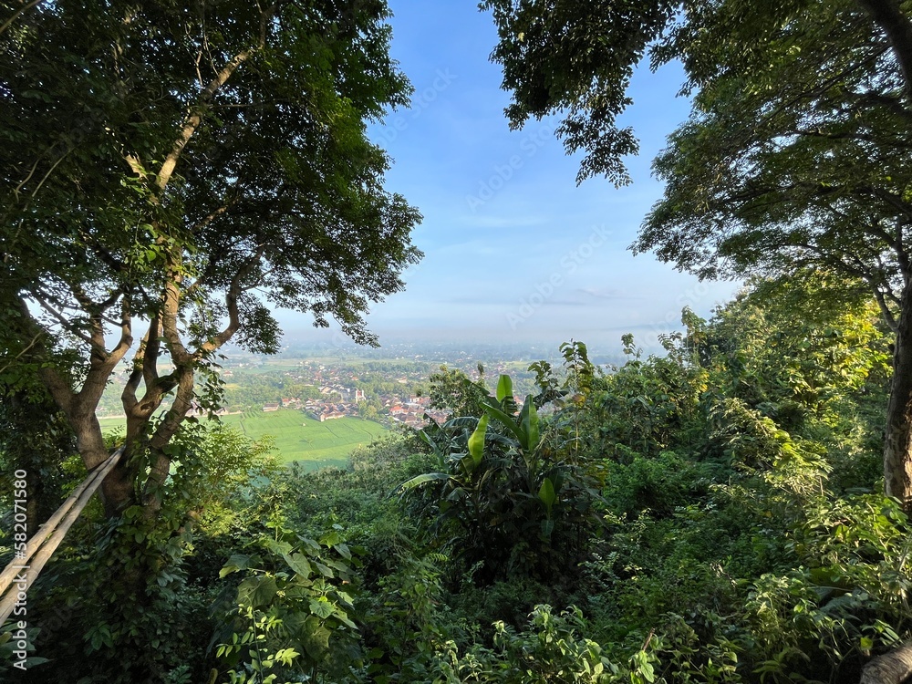 Beautiful aerial view from the top of Indrokilo Hills which is one of tourism destination in Yogyakarta, Indonesia. Photo shows established communities and nature.