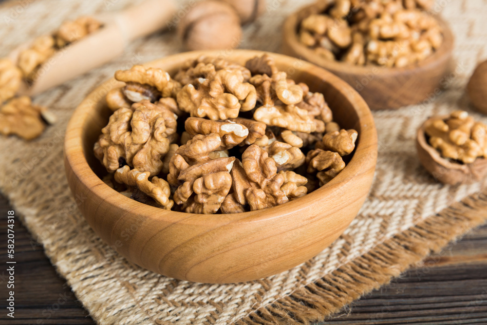 Fresh healthy walnuts in bowl on colored table background. Top view Healthy eating bertholletia concept. Super foods Fresh healthy walnuts in bowl on colored table background. Top view Healthy eating bertholletia concept. Super foods