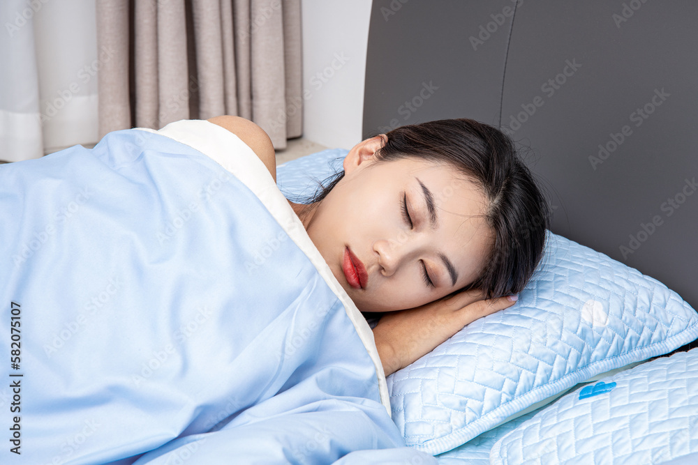 A girl asleep on a mattress A girl asleep on a mattress