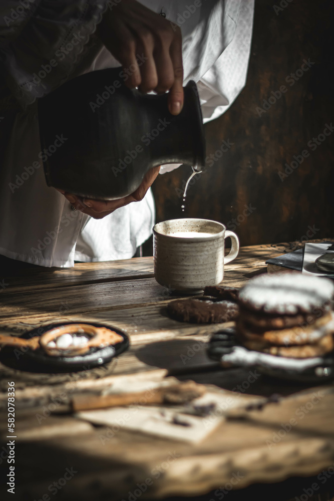 Delicious oatmeal chocolate chip cookies on a wooden table. Cozy atmosphere of the home.