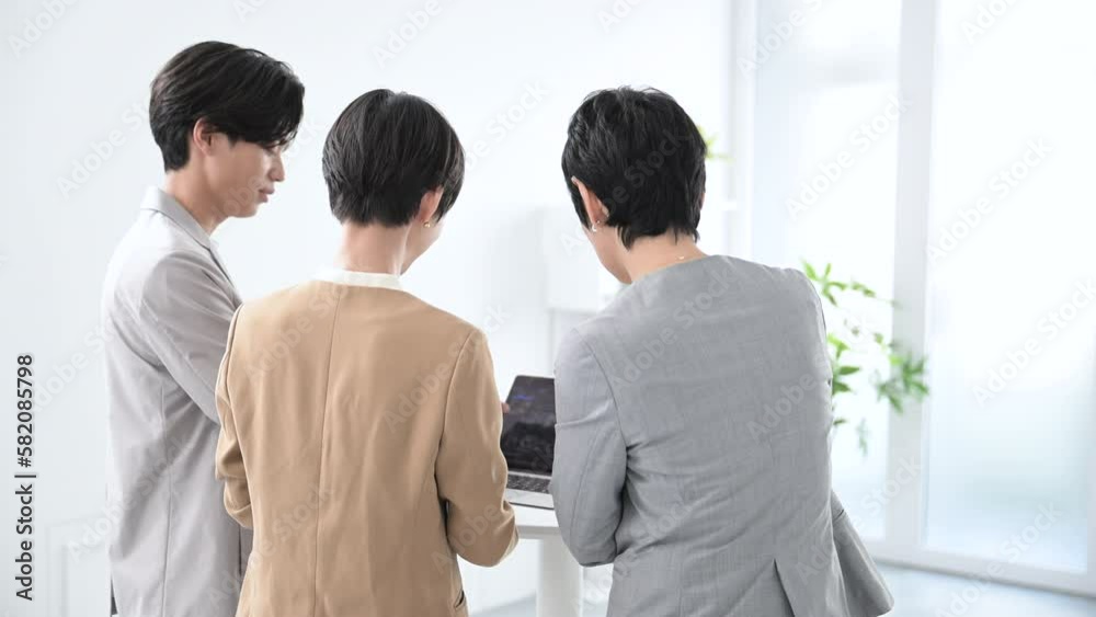 Team having an internal meeting Video of the business scene in the back Team having an internal meeting Video of the business scene in the back