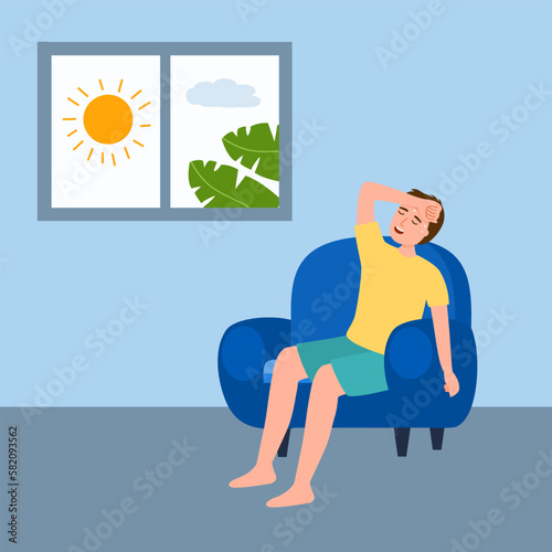 Sweaty man sitting in his house. He exhausted of hot summer day.