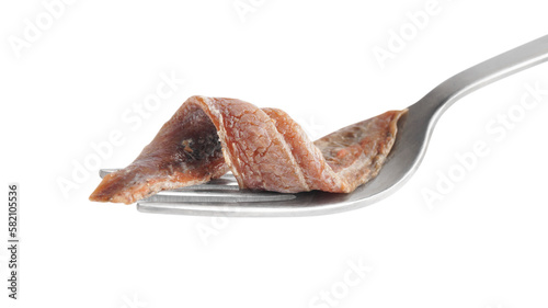 Fotografie Fork with delicious anchovy fillet isolated on white