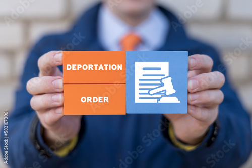 Man holding colorful blocks with inscription: DEPORTATION ORDER. Concept of deportation, asylum refugees. The problem of forced deportation in the occupied territories.