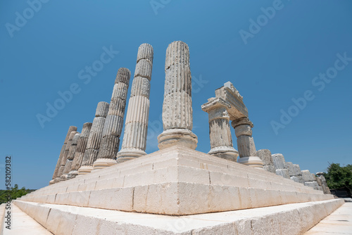 apollo temple stairs and pillars accompanied by blue sky and green grass ground