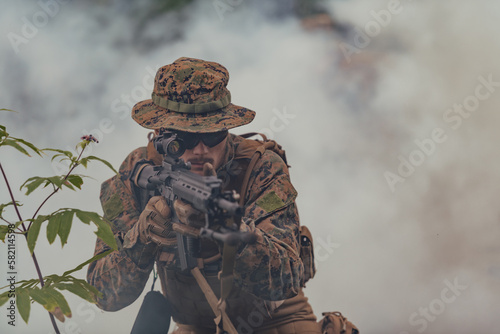 A soldier fights in a warforest area surrounded by fire
