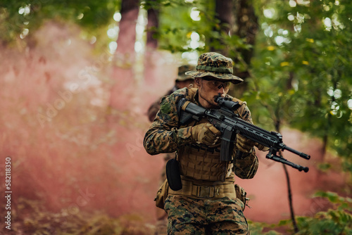 Battle of the military in the war. Military troops in the smoke