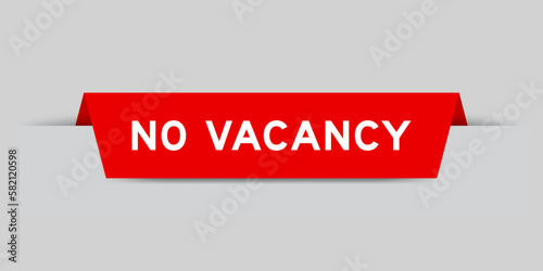 Red color inserted label with word no vacancy on gray background