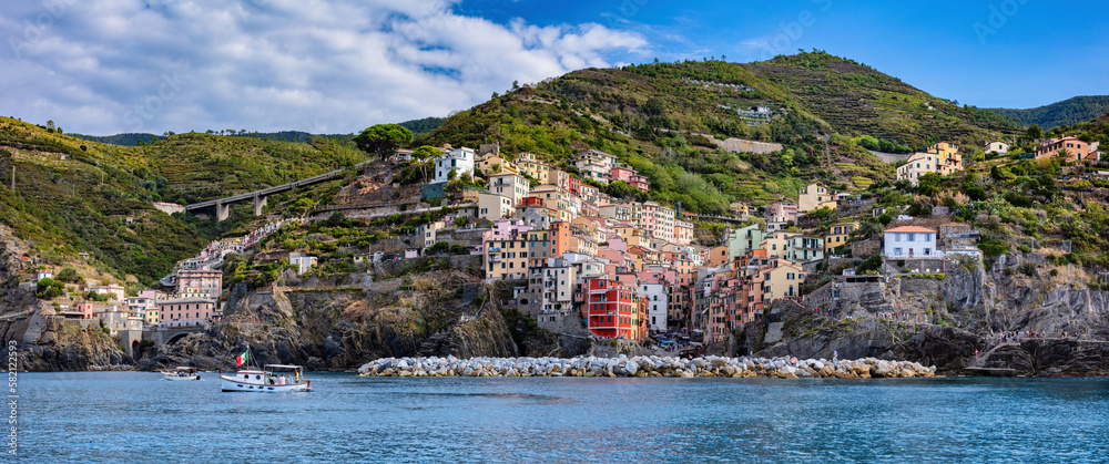 Cinque Terre coast with Riomaggiore village in Italy panorama