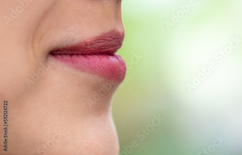 The lips of a young girl as a background.